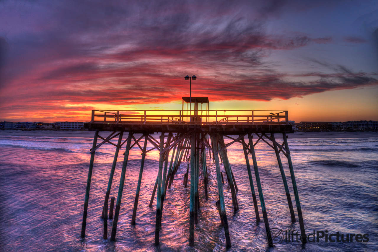 Head-on view of the Kure Beach pier at civil twilight