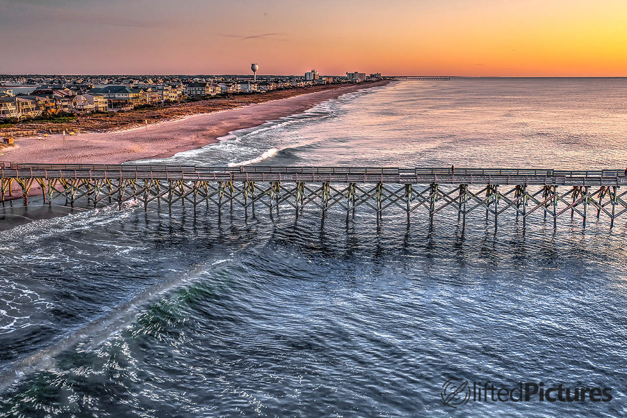 Crystal Pier at Wrightsville Beach, North Carolina, seen from the side at sunrise