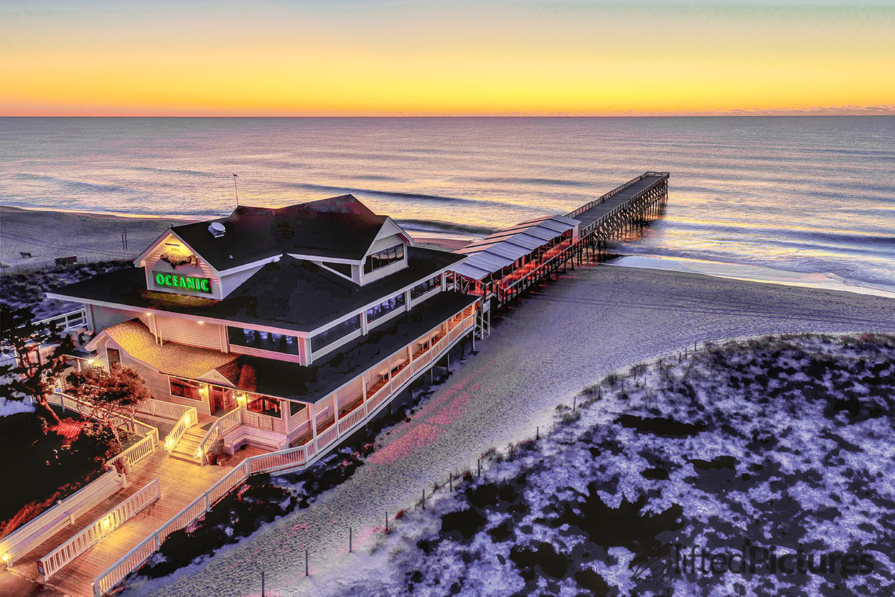 The Oceanic pier building at Wrightsville Beach, with the pier receding toward the ocean