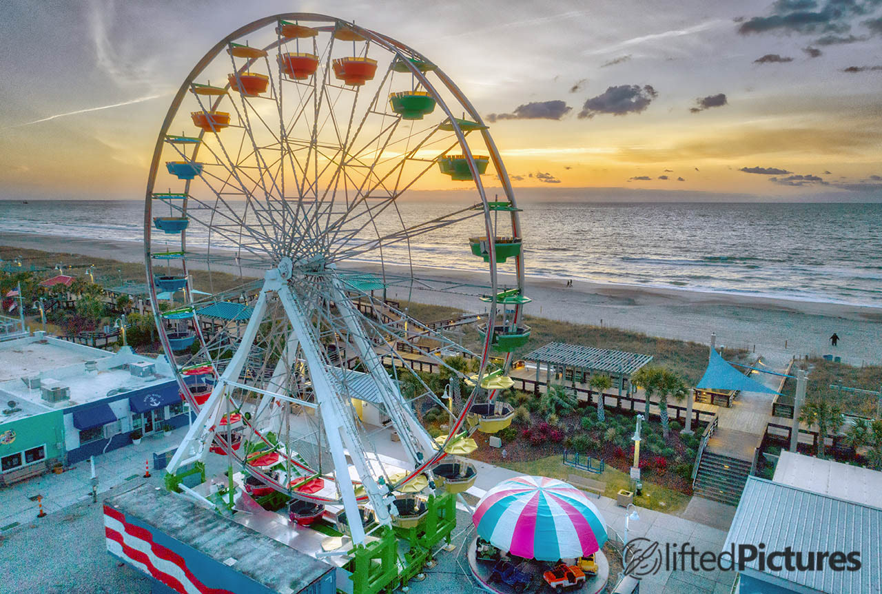 Carolina Beach ferris wheel at sunrise, with the beach and ocean beyond