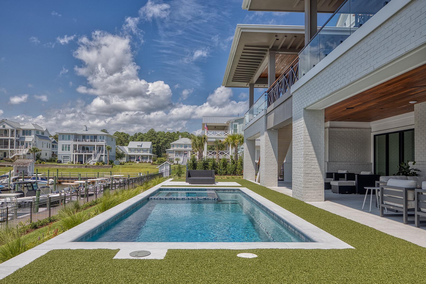 Waterfront home with private pool and contemporary coastal architecture
